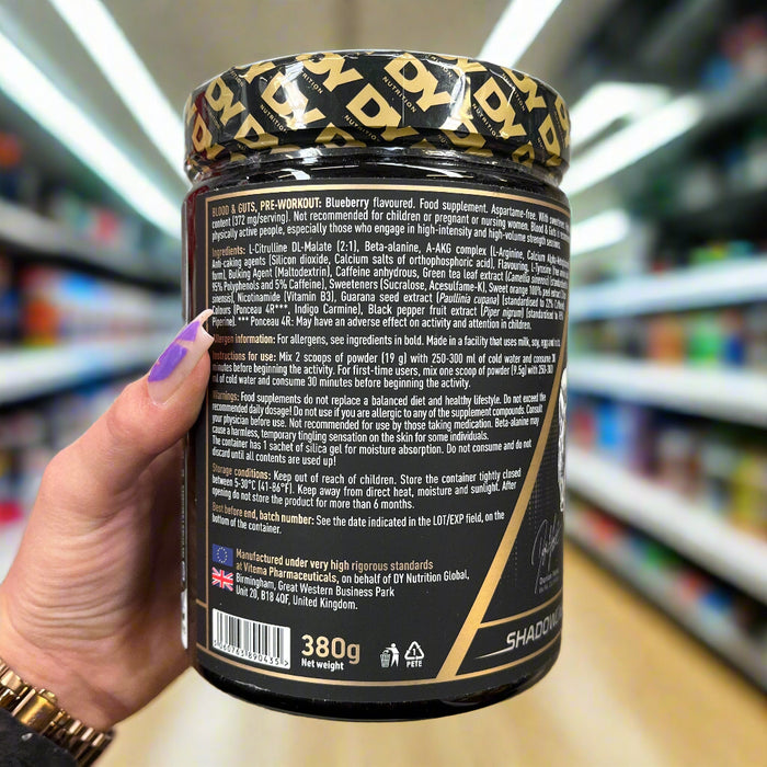 Close-up of (Dorian Yates DY Nutrition Blood And Guts 380g) held up inside My Supplement Shop, clearly showing key ingredients on the packaging in a Sports Nutrition setting.