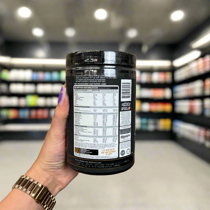 Close-up of (EHP Labs Pride Preworkout 40 Servings) held up inside My Supplement Shop, clearly showing Nutritional Values on the packaging in a Sports Nutrition setting.