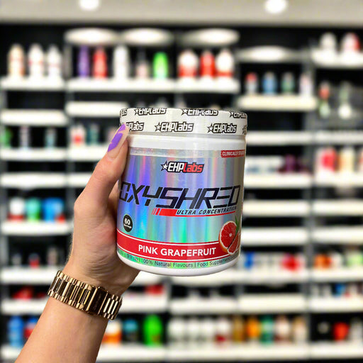 Close-up of (OxyShred Ultra Concentration 60 Servings) held up inside My Supplement Shop, clearly showing the front label in a Sports Nutrition setting.