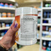 Close-up of (Per4m Amino Burn 240g) held up inside My Supplement Shop, clearly showing Nutritional Values on the packaging in a Sports Nutrition setting.